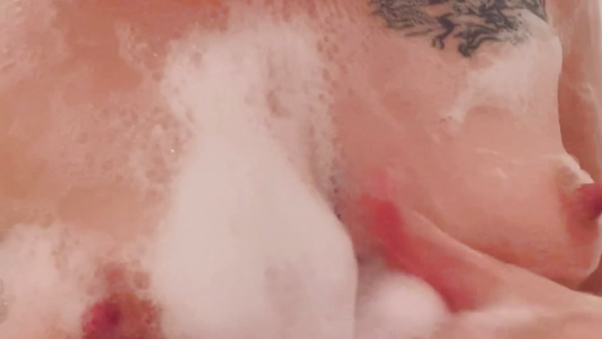 Naked boobs in soap foam