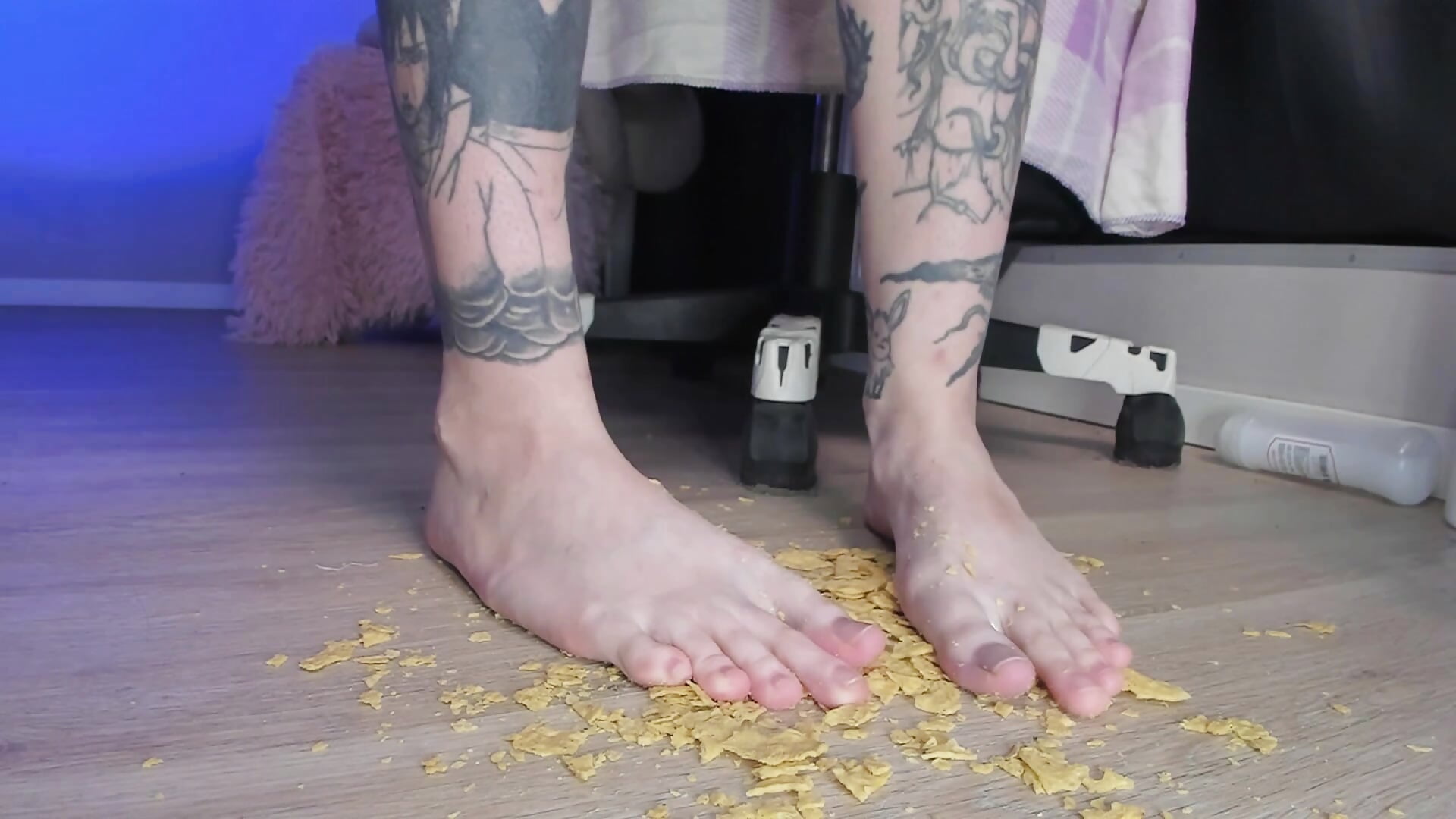 crush nacho chips with my feet, play with crumbs, showing toes