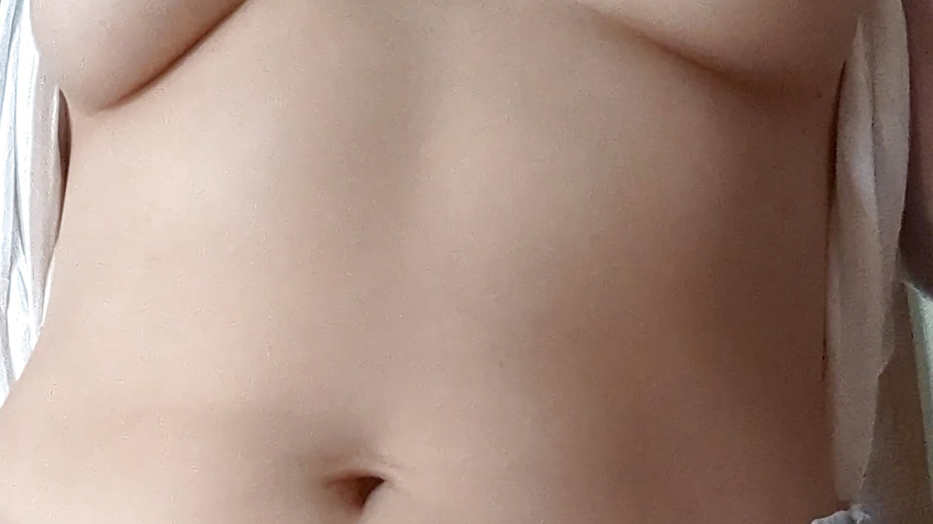 Tit reveal, smiling, and showing off my ass for you in my t-shirt and lounge shorts. My morning.