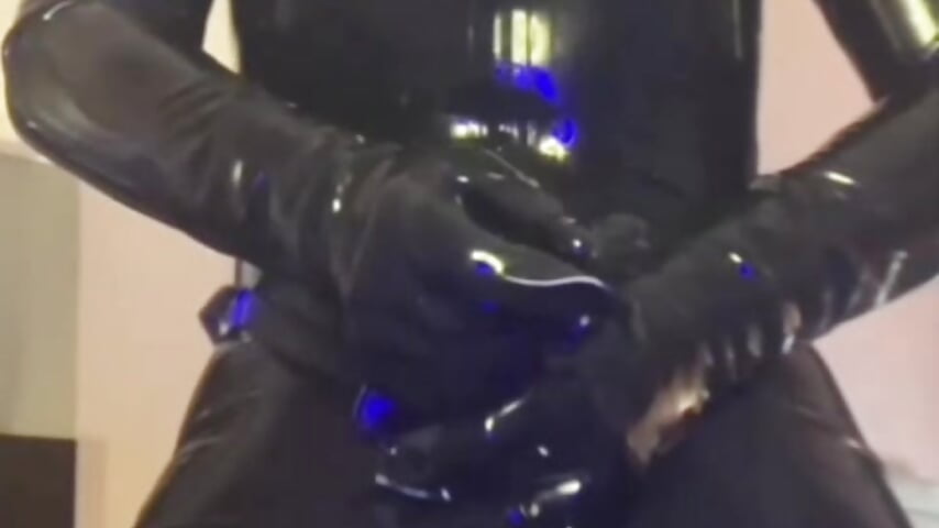 Mistress Ruby fully encased in Latex with Strap-on