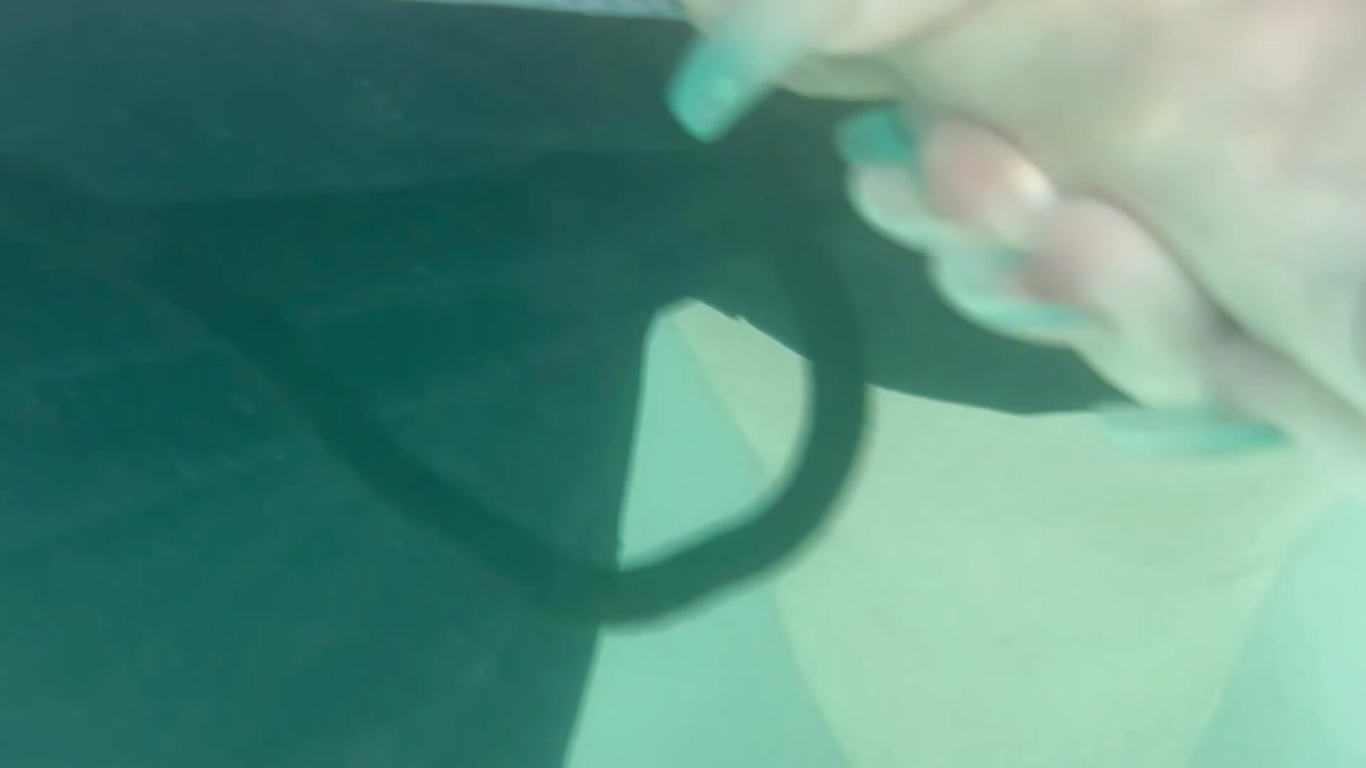Cheeky handjob in the sea