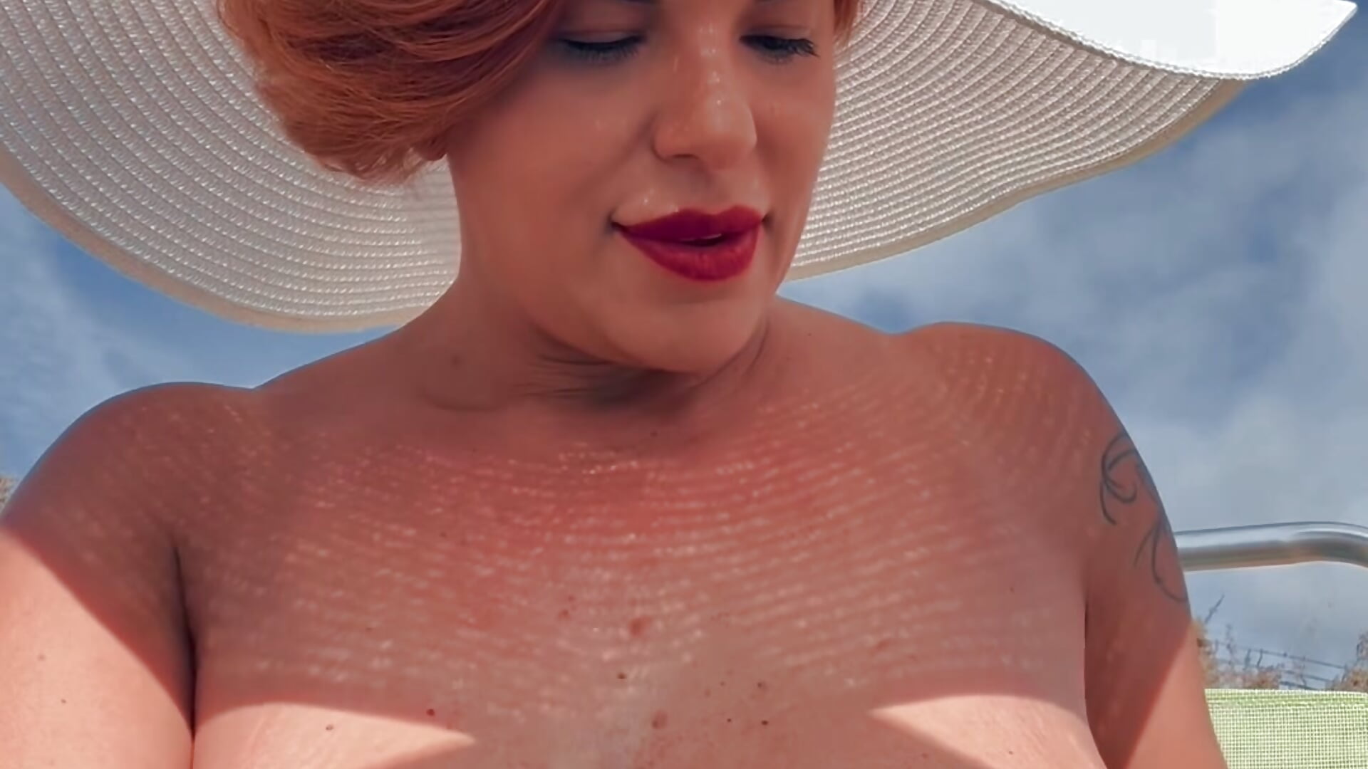 topless in the beach with cream tits