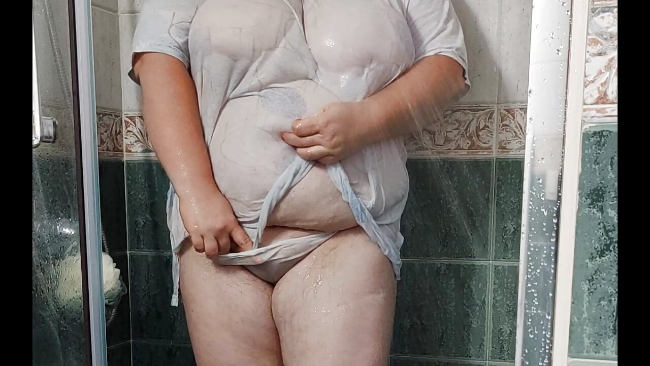 in clothes under the shower