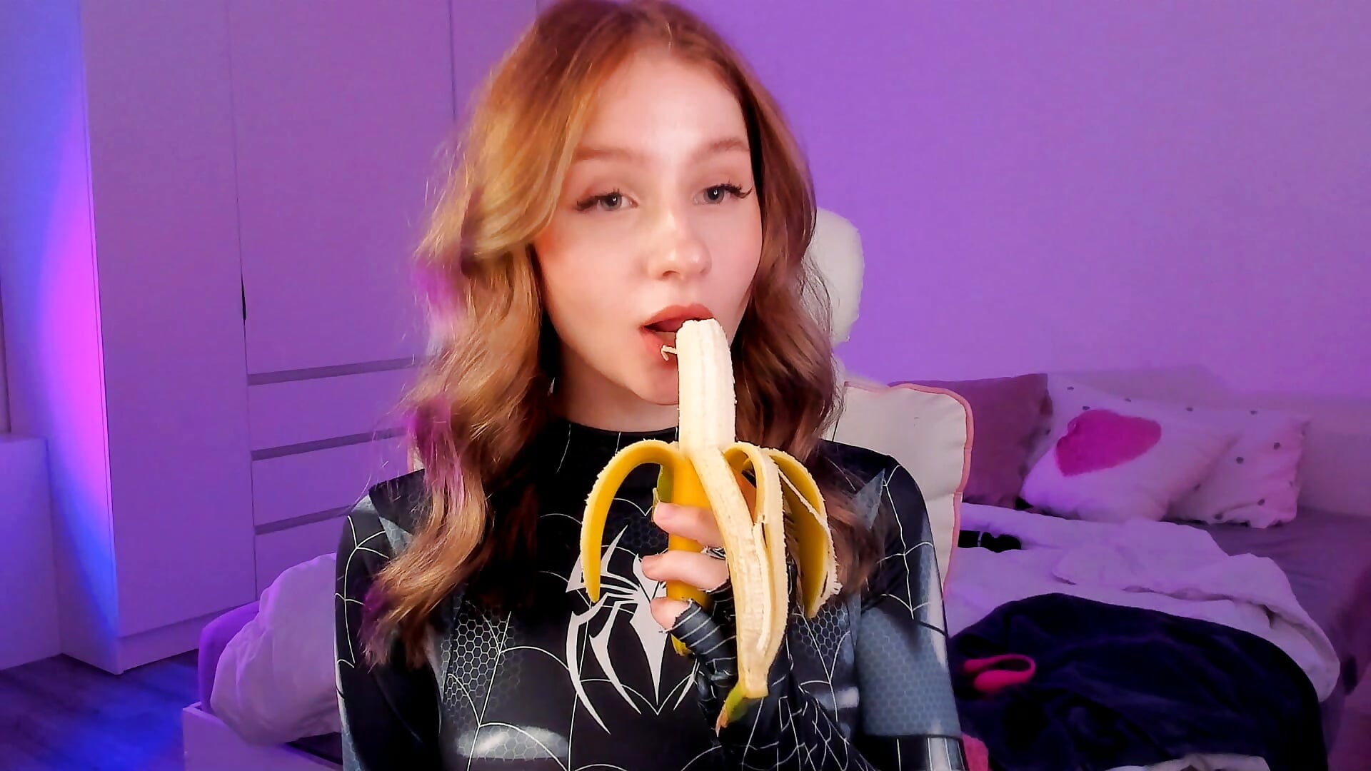 Spiderwoman eats  banana