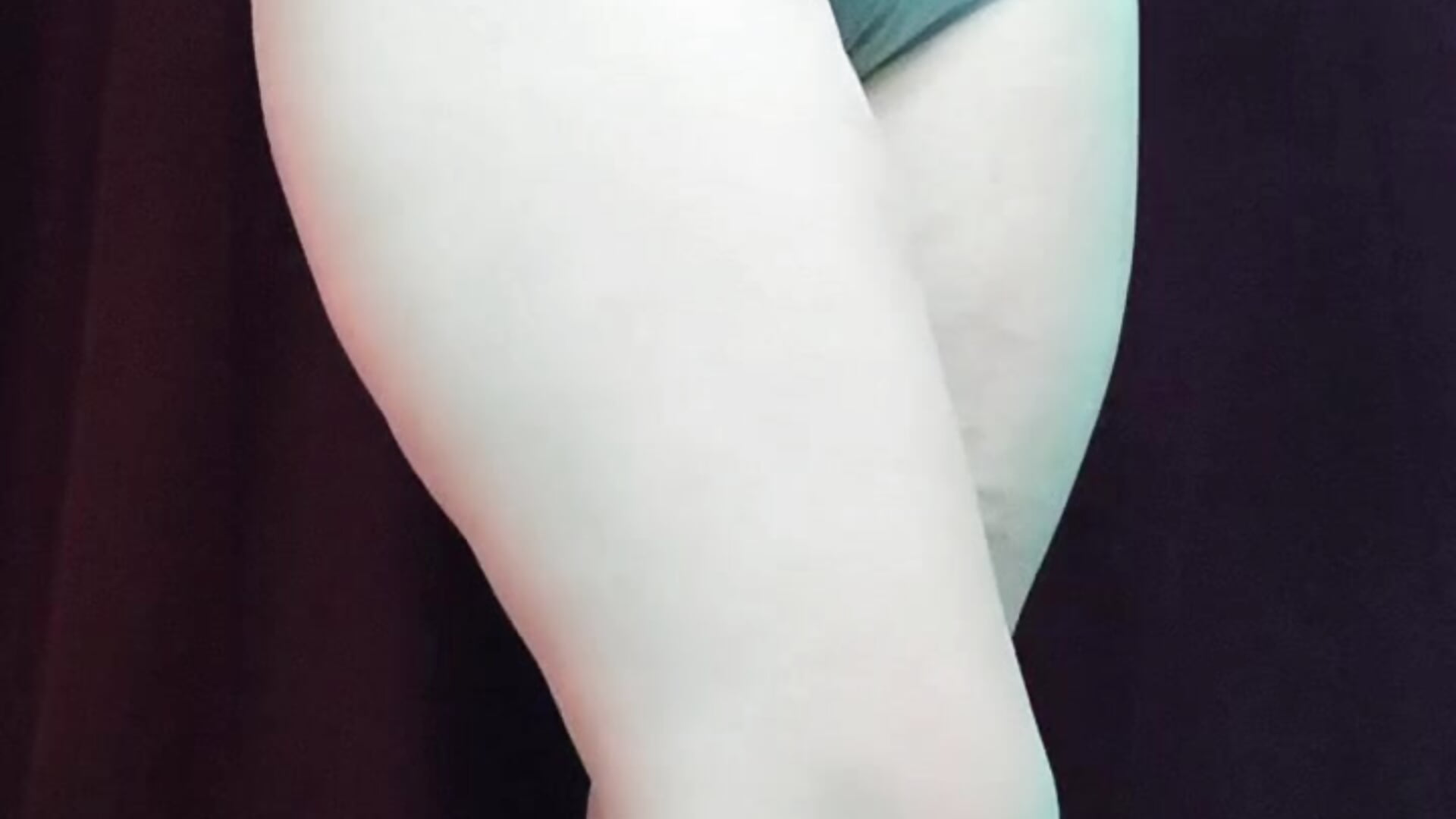 trying on a white bra in a store