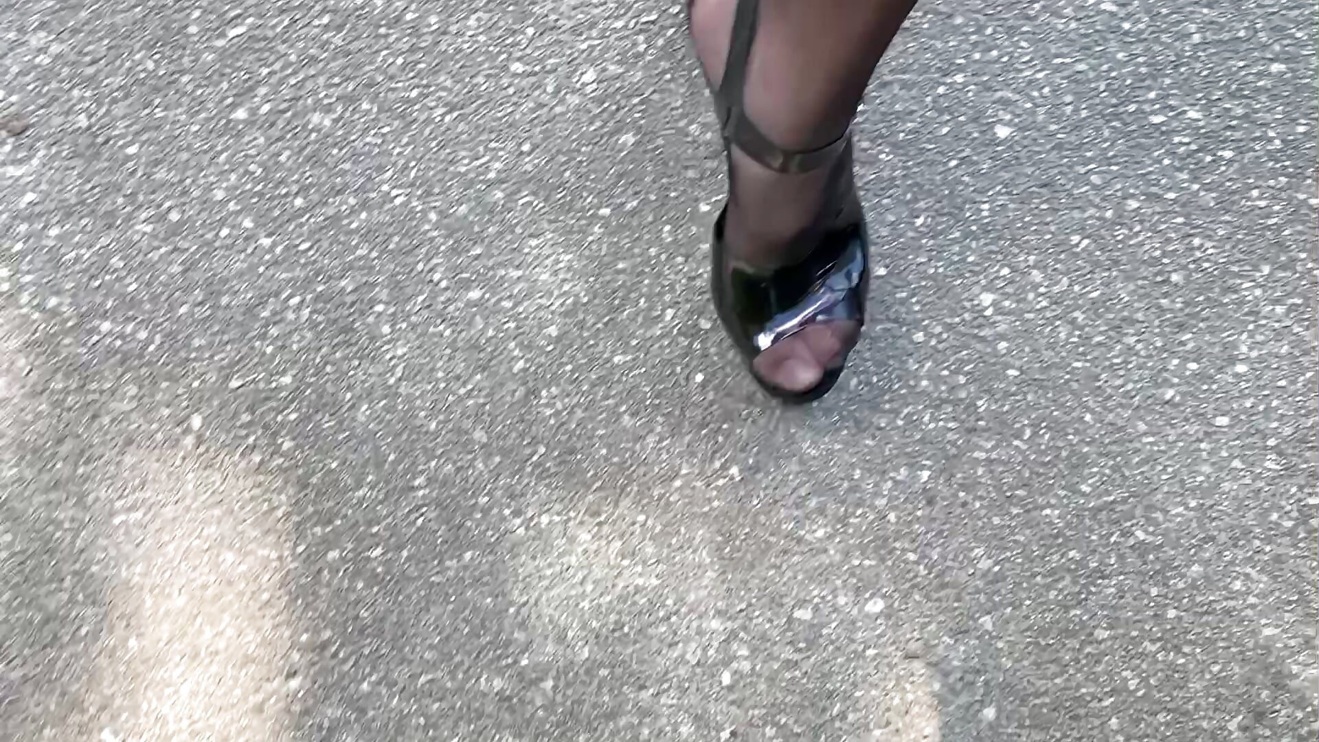 Black Heels walk with black stockings and shiny leggings