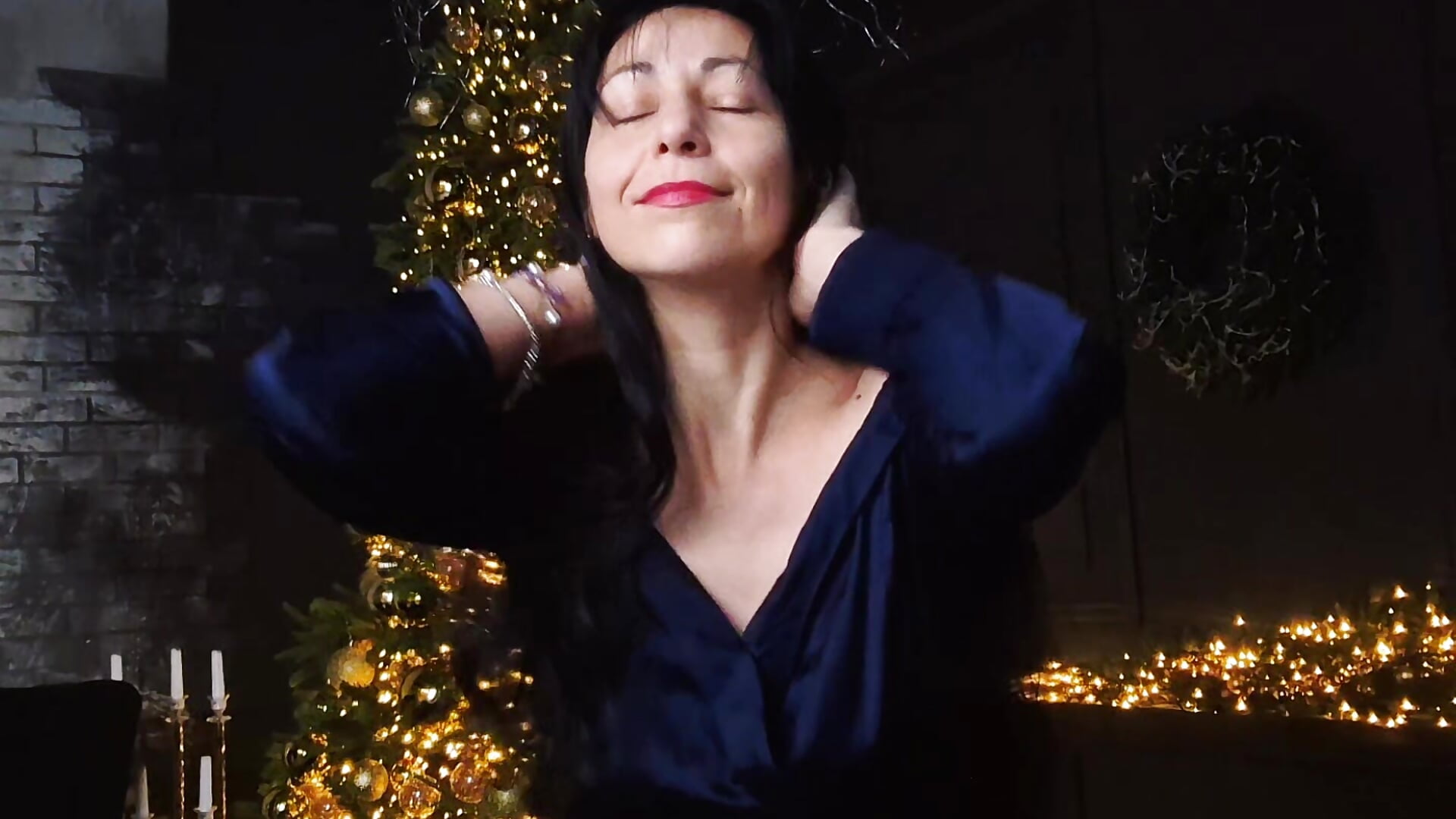 Playing with my hair under the tree for Christmas