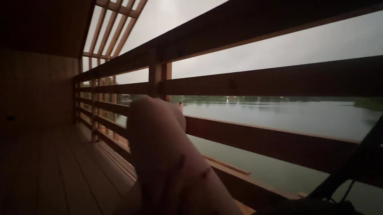 Mistress's legs are resting on the lake
