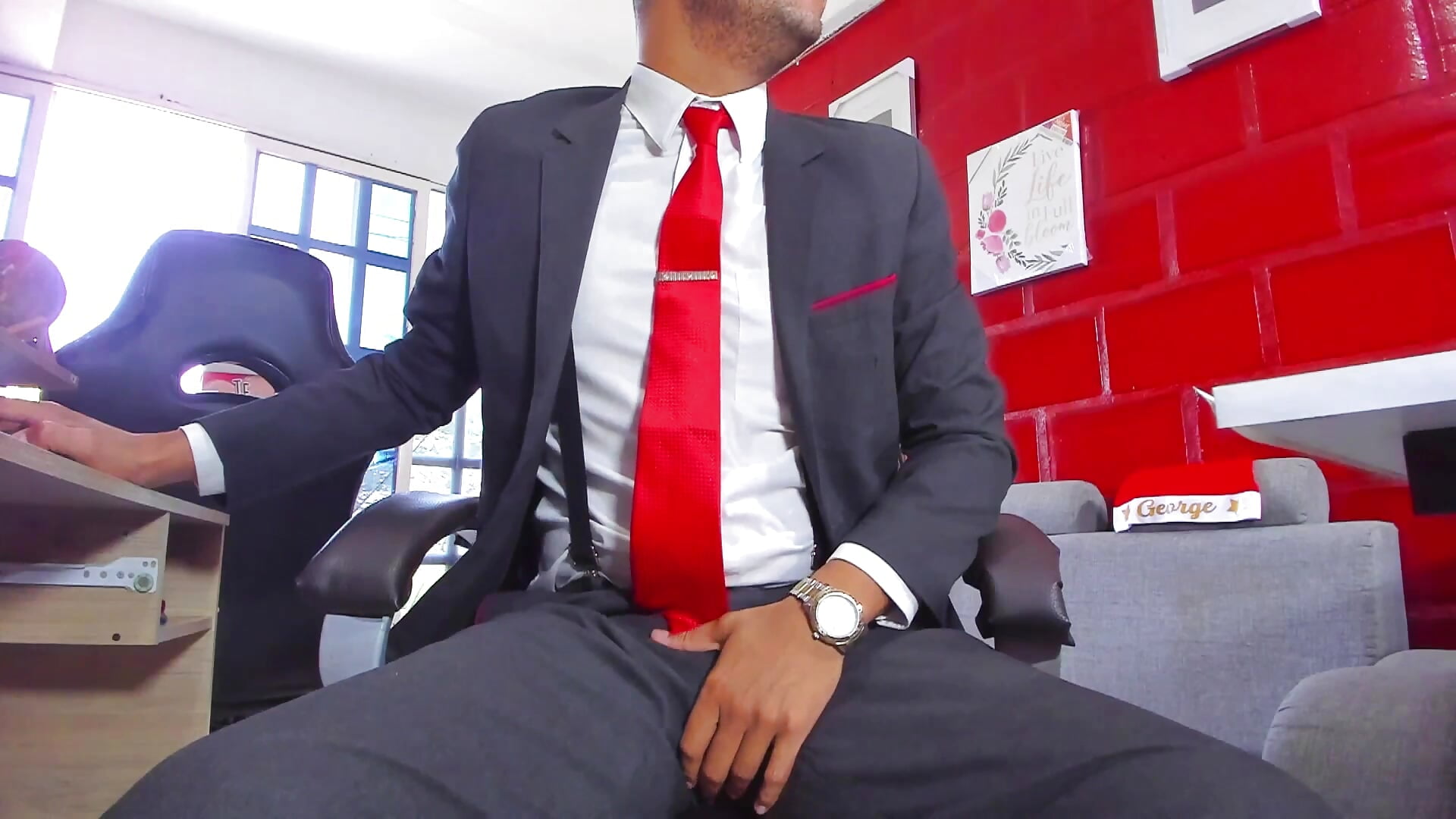 BOSS SHOWING HIS SUIT AND FEET