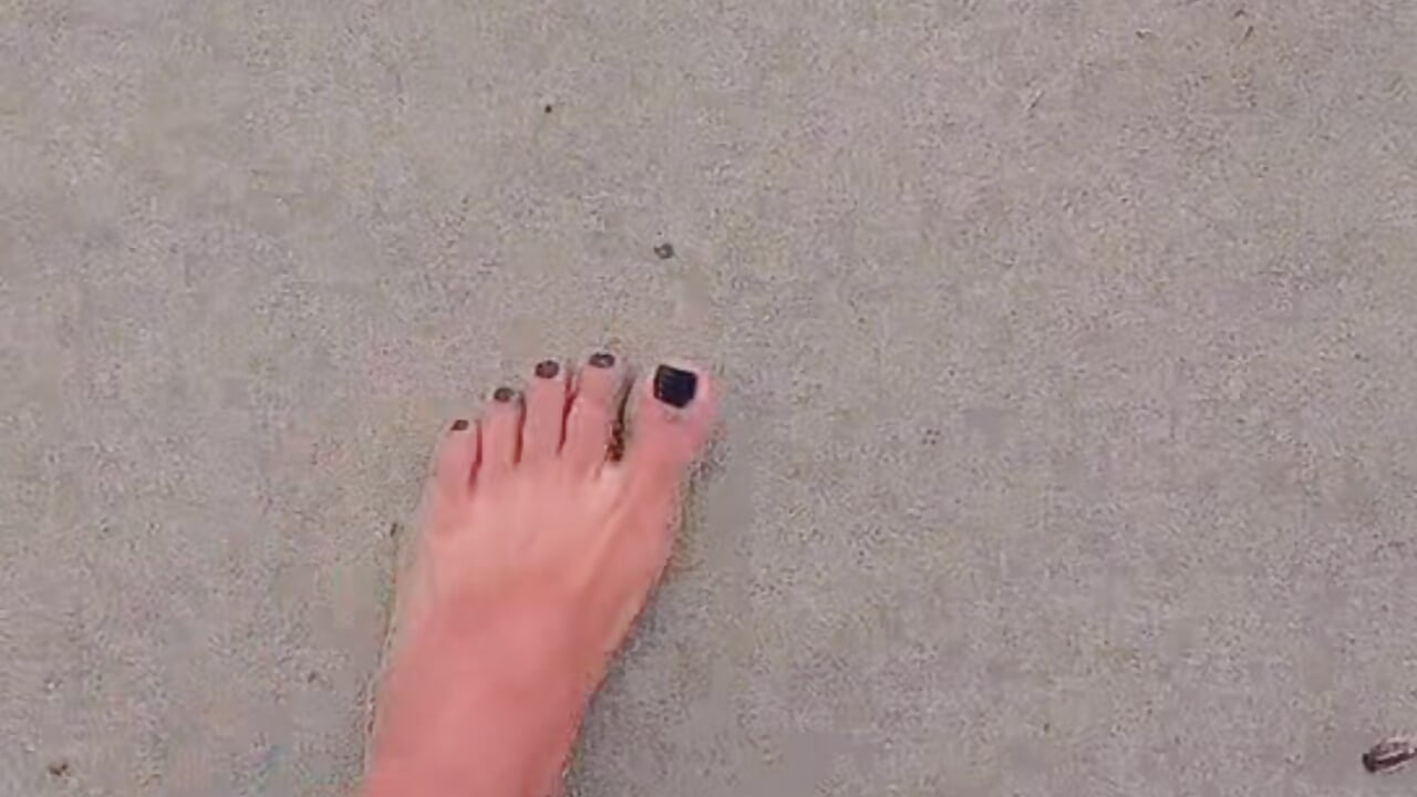 WALKING BAREFOOT ON THE BEACH SAND