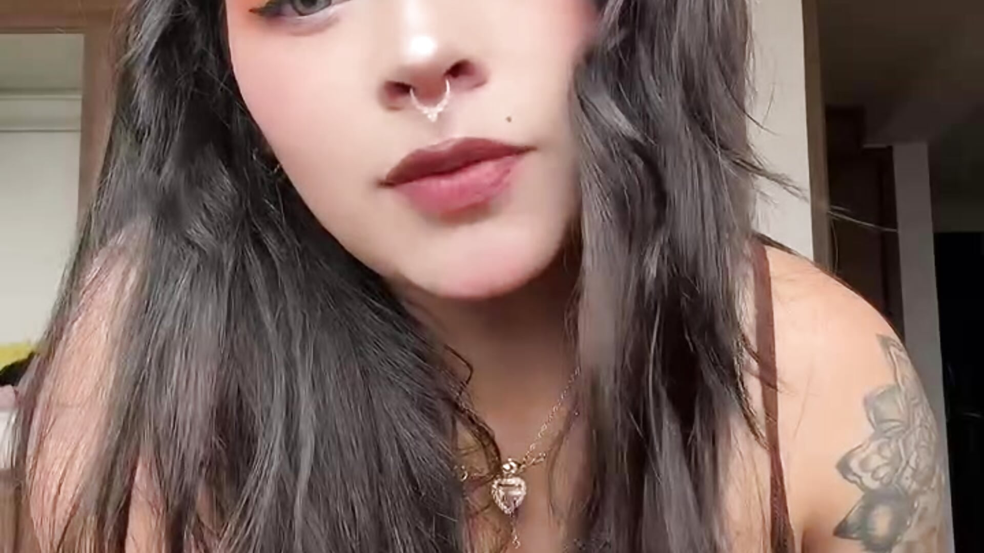 A woman's face with a look of intense pleasure