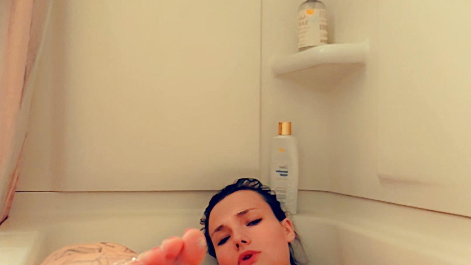 In the bath playing with pussy