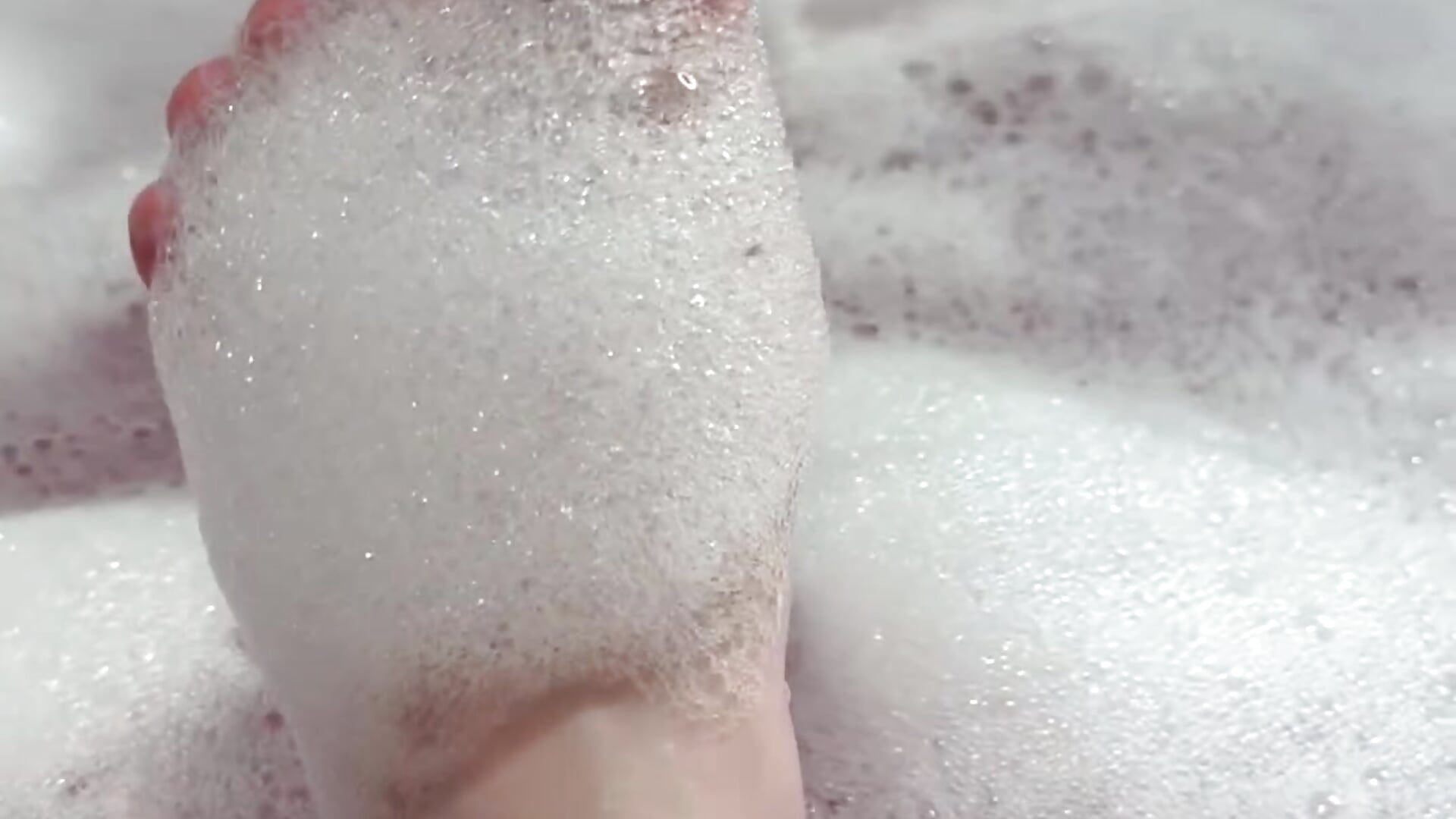 my cute feet in pink water in the bathroom