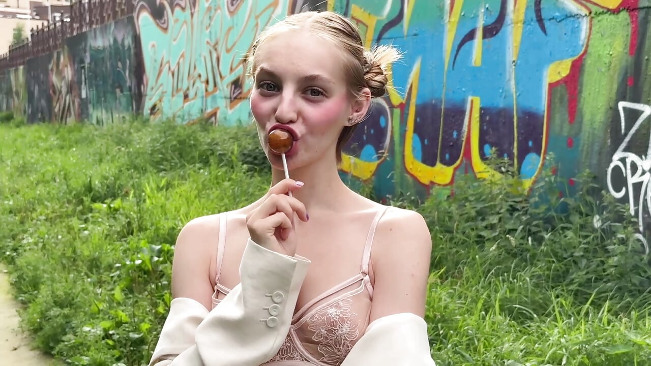 Sucking a lollipop outdoors - video by Lili_Lucky cam model