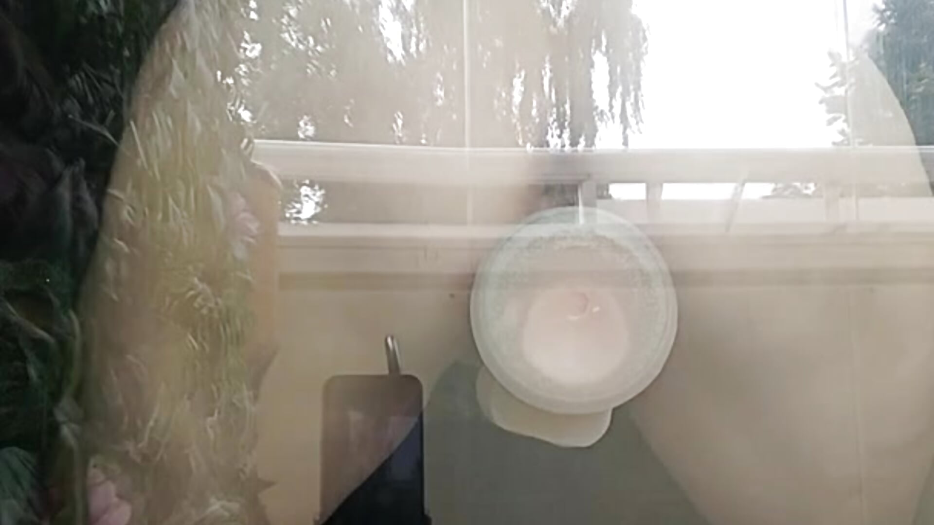 Dildo sex behind the glass balcony door