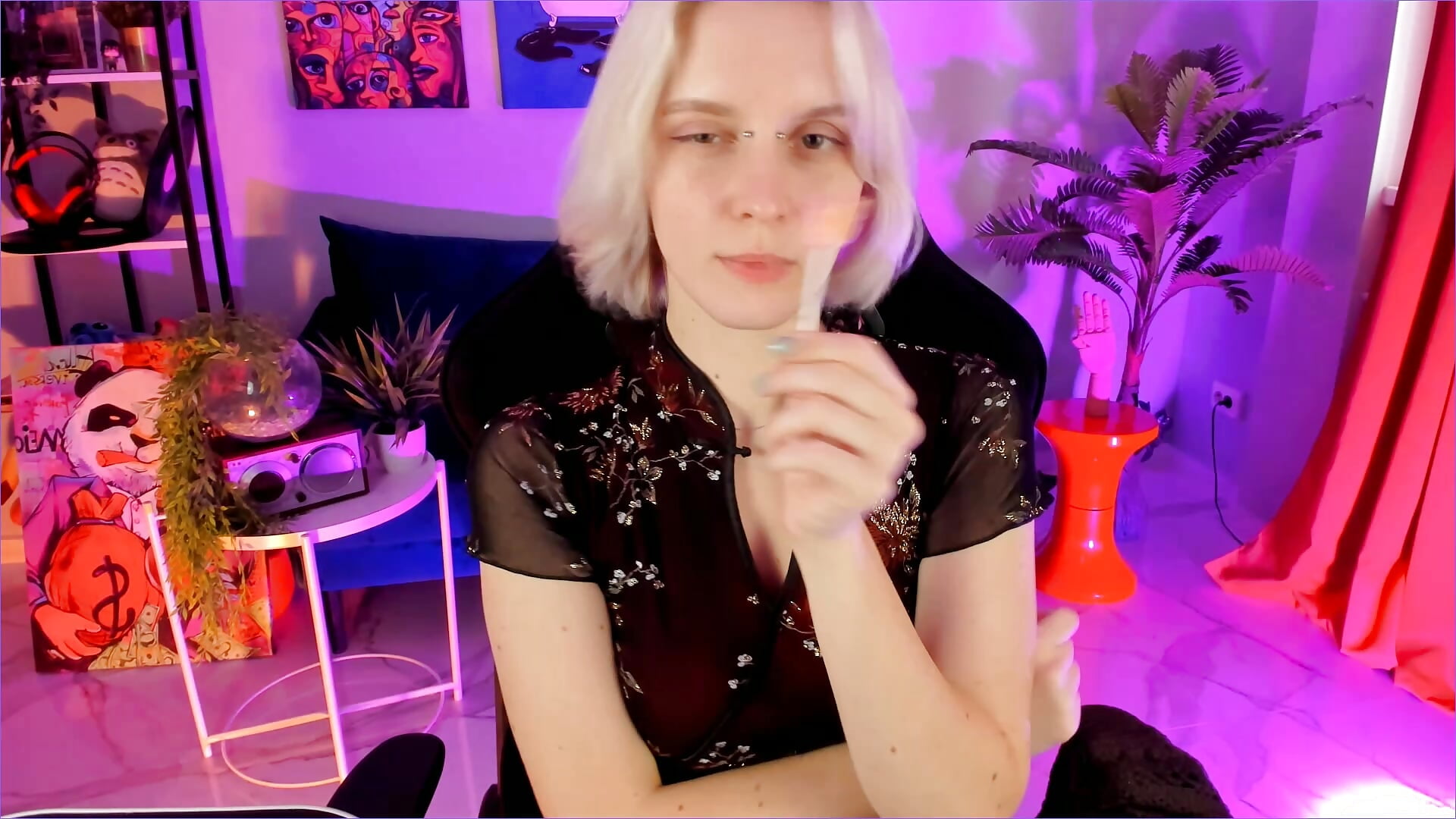 I'm sitting opposite you, sucking on a lollipop. What are you doing?
