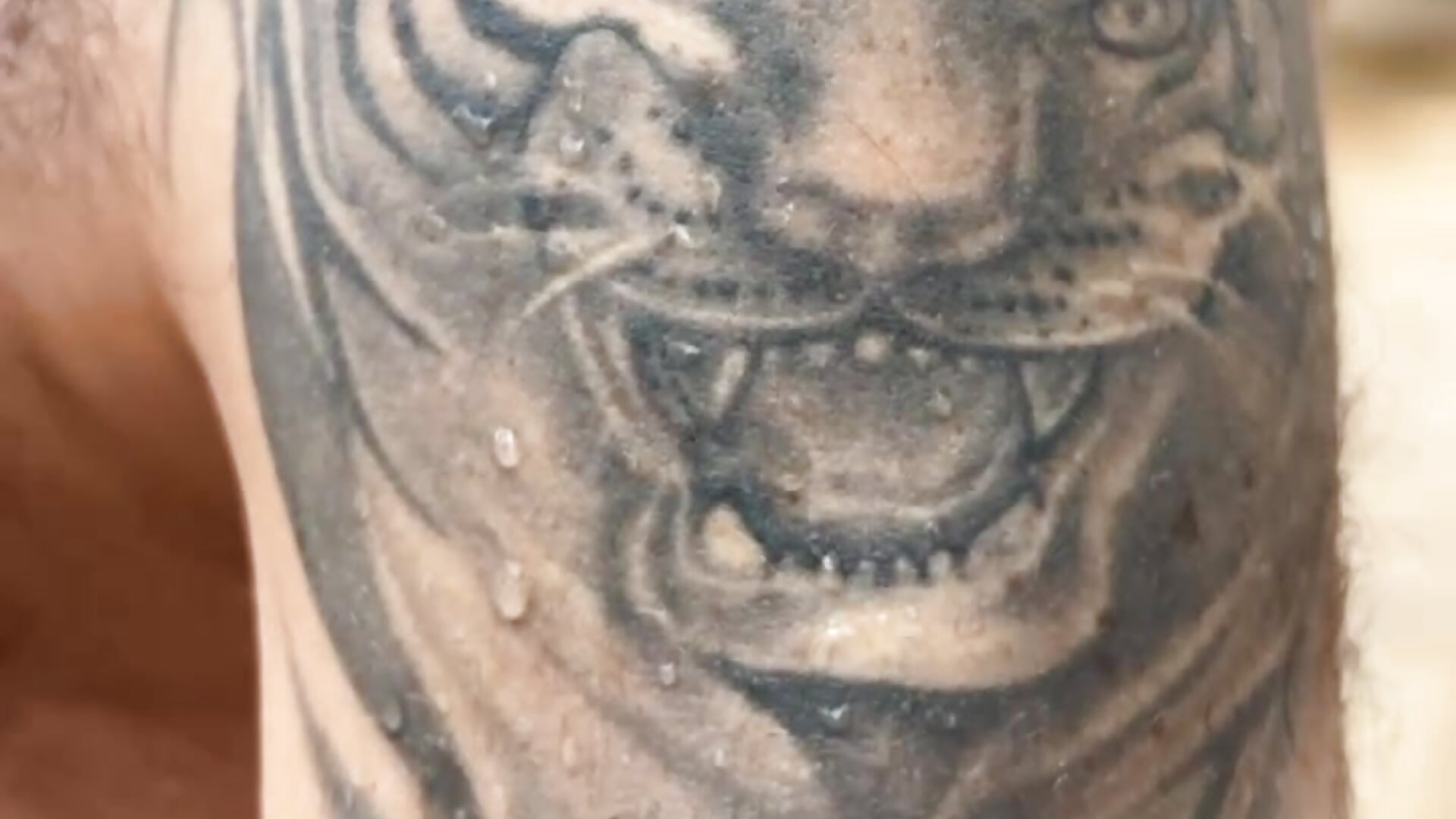 Dan on holiday show his 4 Tattoos