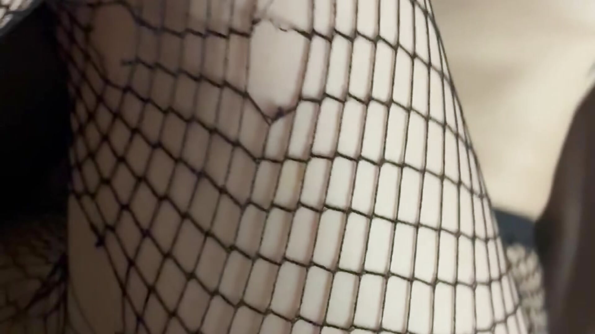 Strapping Ravyn in fishnets
