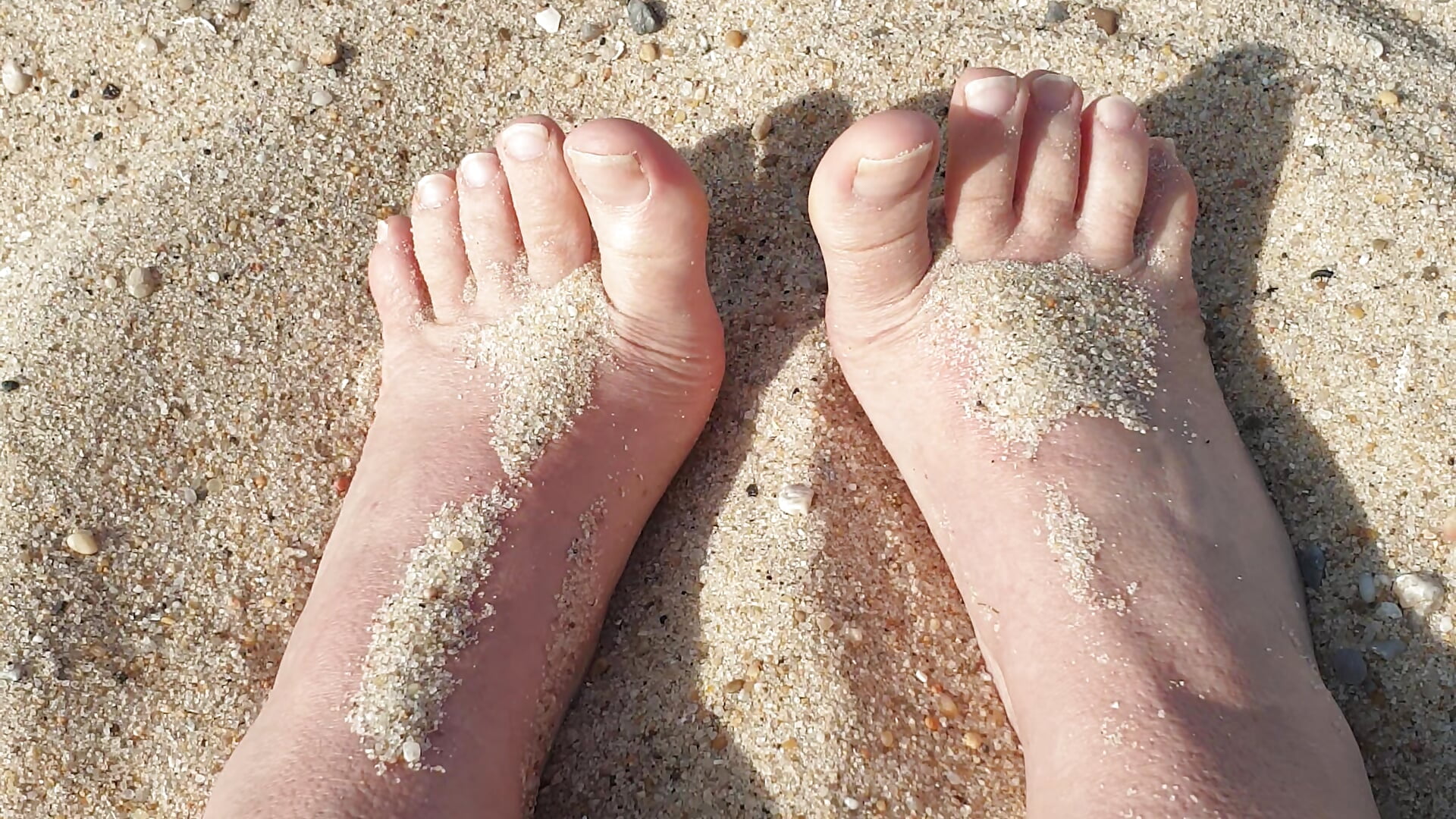 Feet in the sand