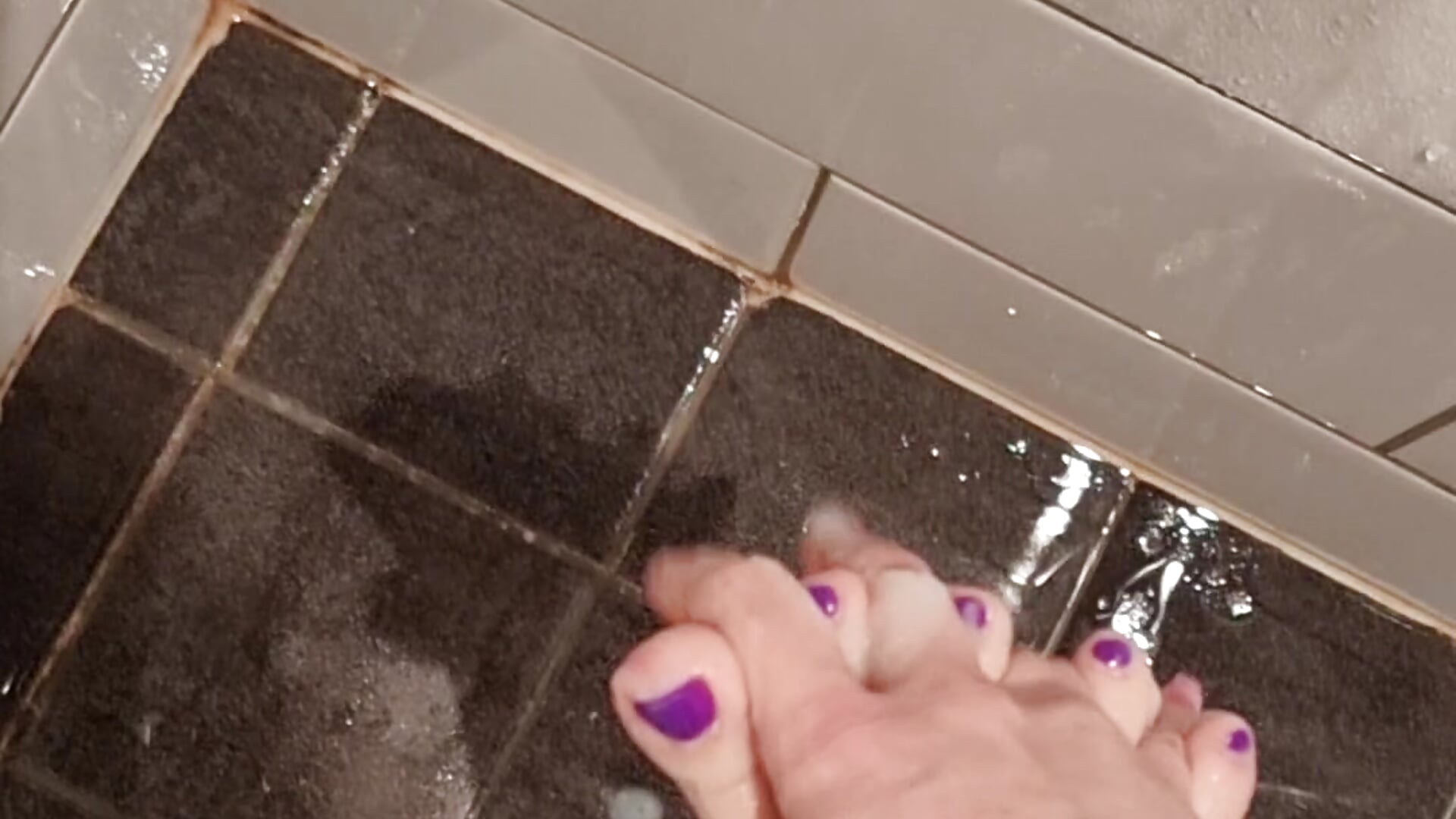 Play with feet in shower