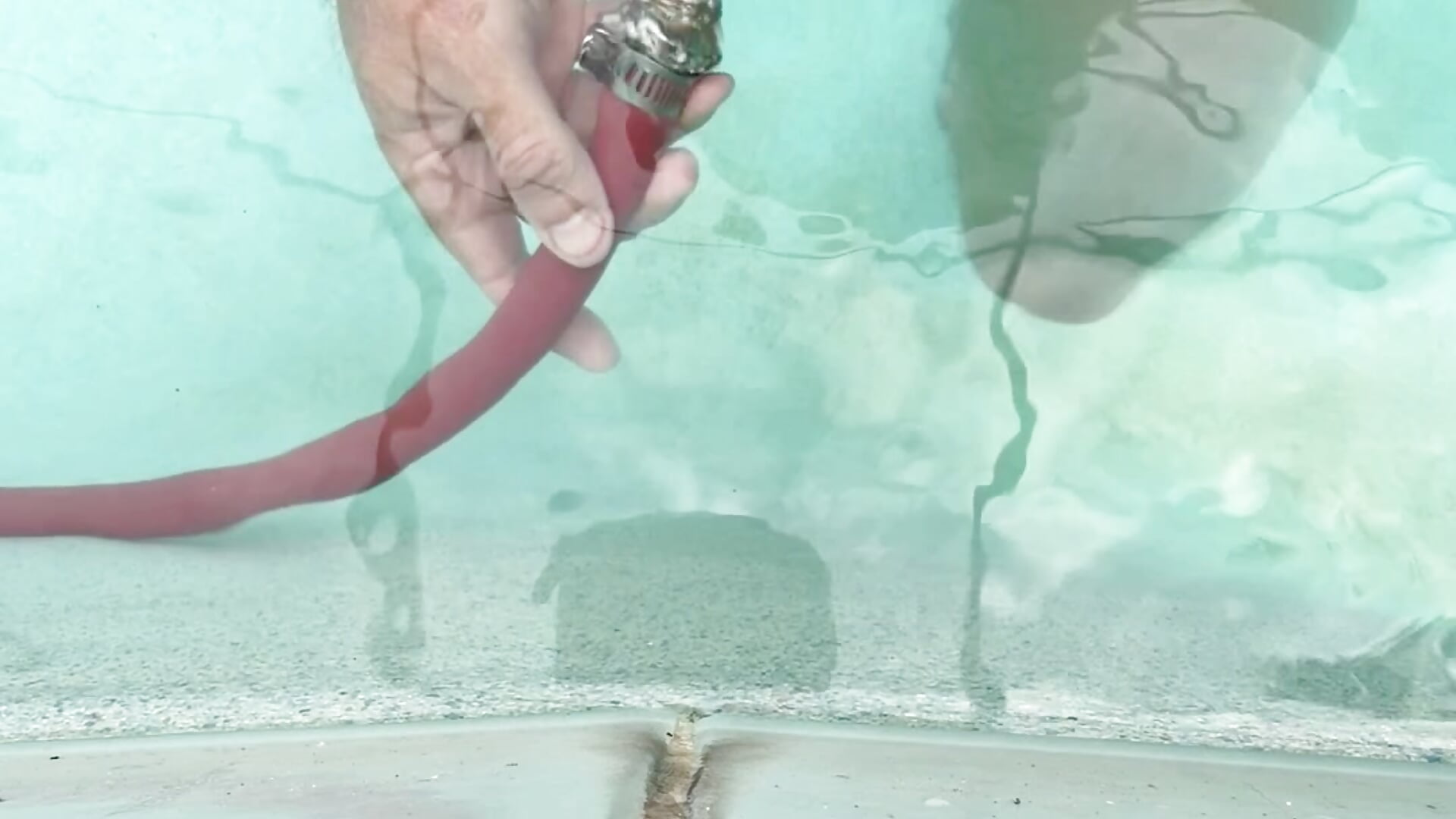 Getting off under water!  I use the water hose on the head of my rock hard cock and shoot ropesz - video by FitFloridaDaddy cam model