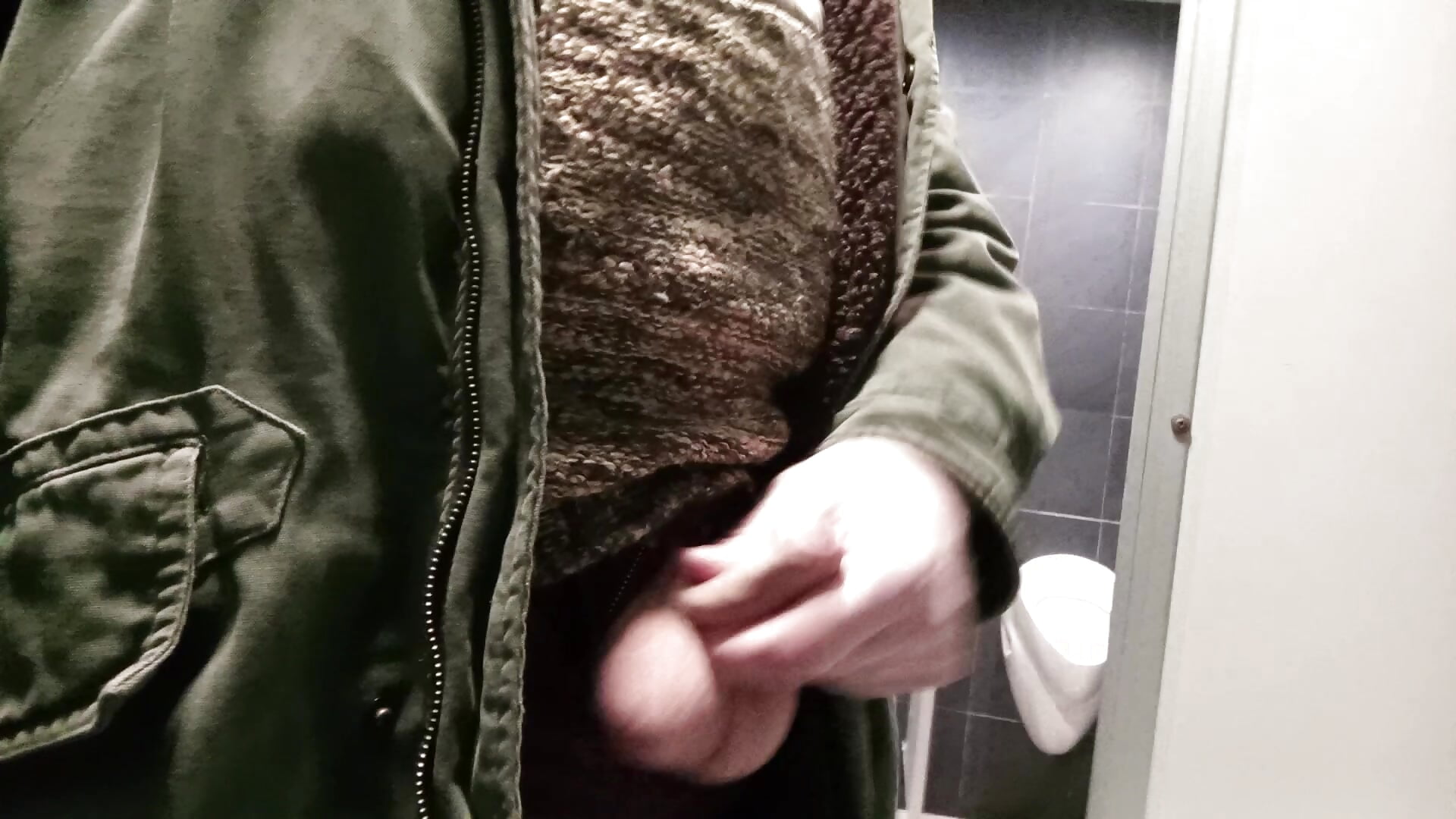 Masturbation in a public toilet with the door open