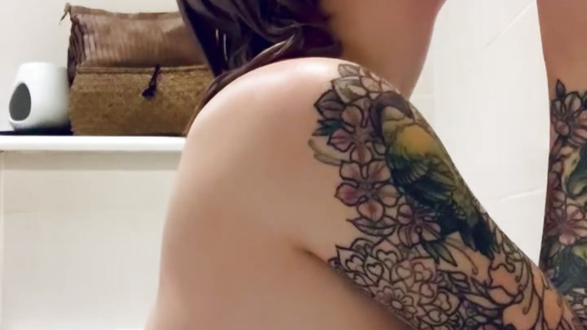 Sucking off a big dildo all wet in the bath
