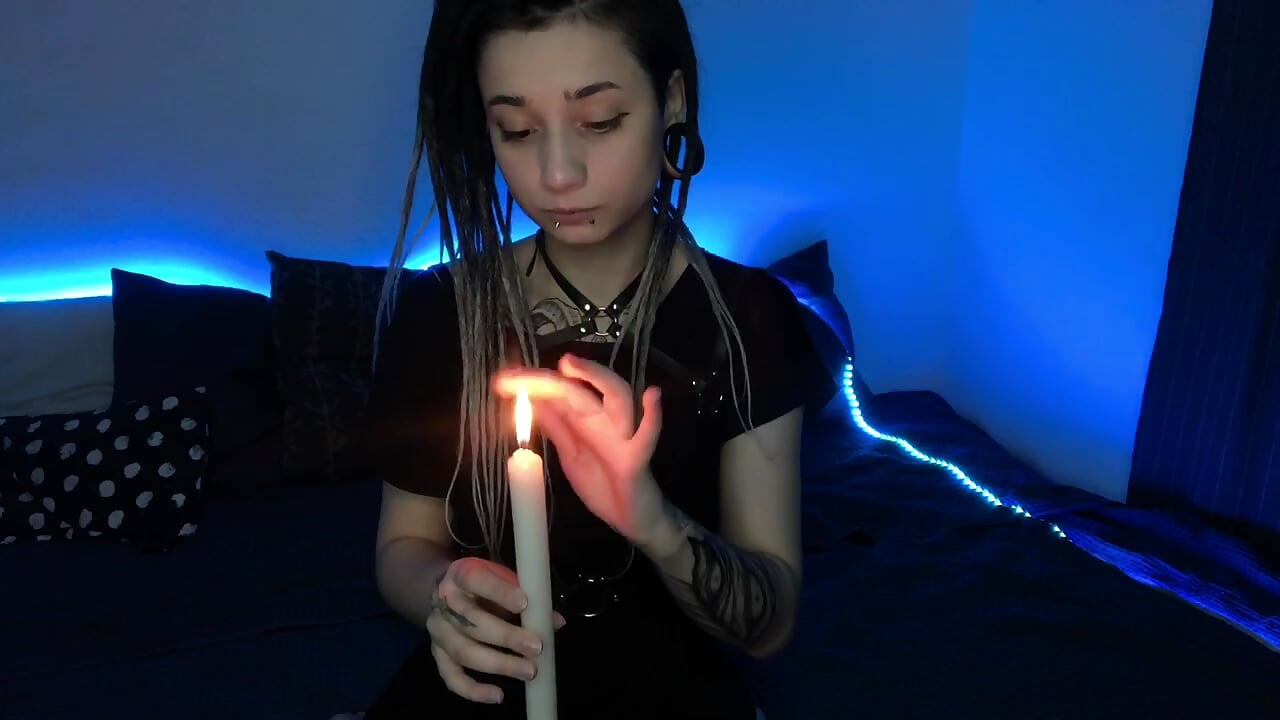 Playing with candle in swordbelt - video by Nikki_Evans cam model