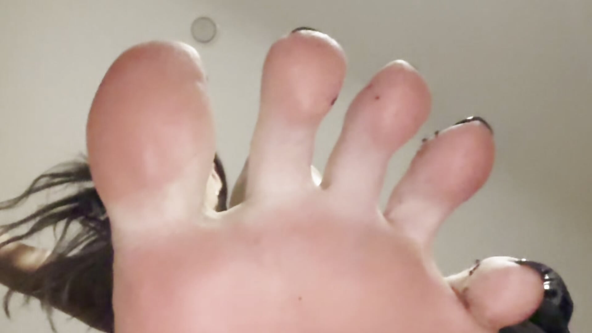 Dirty feet on loser's face