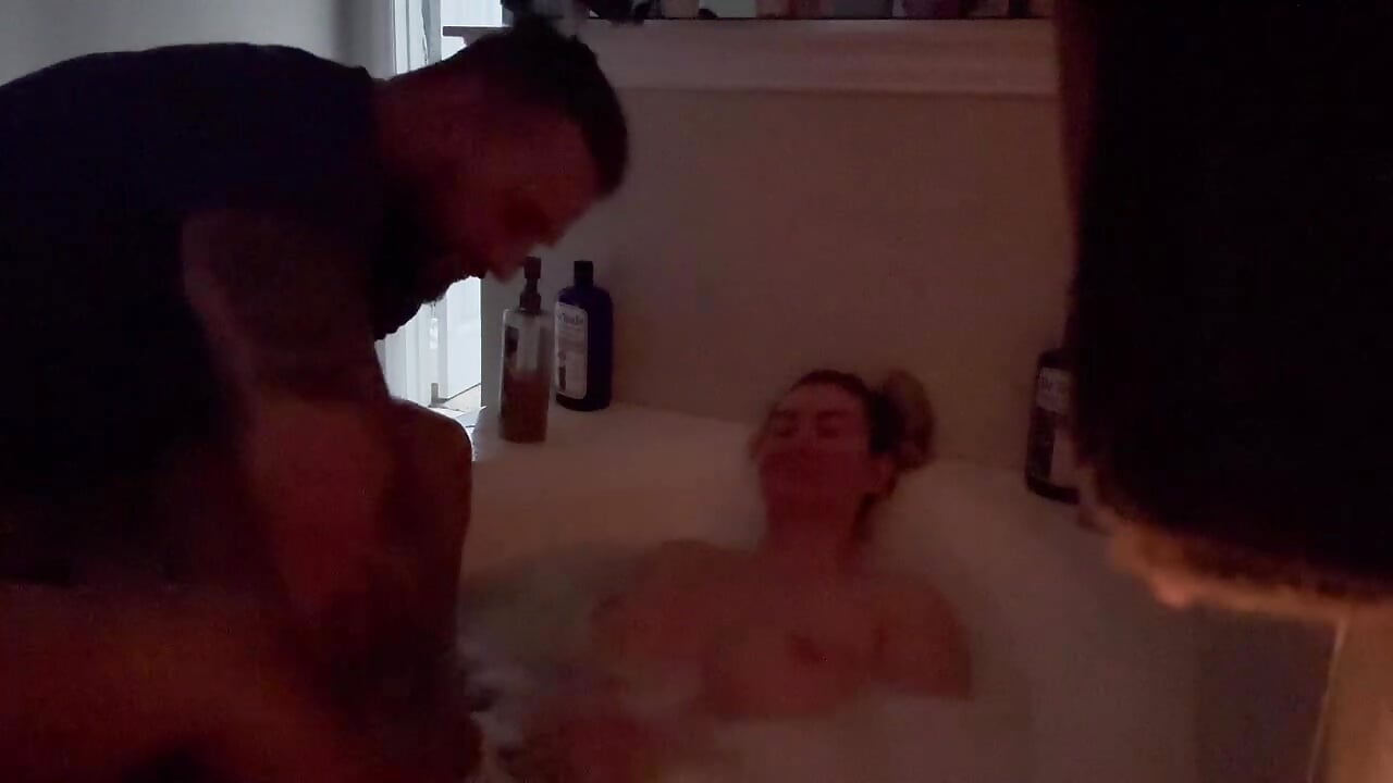 naked in bathtub as he rubs my pussy then I suck his dick