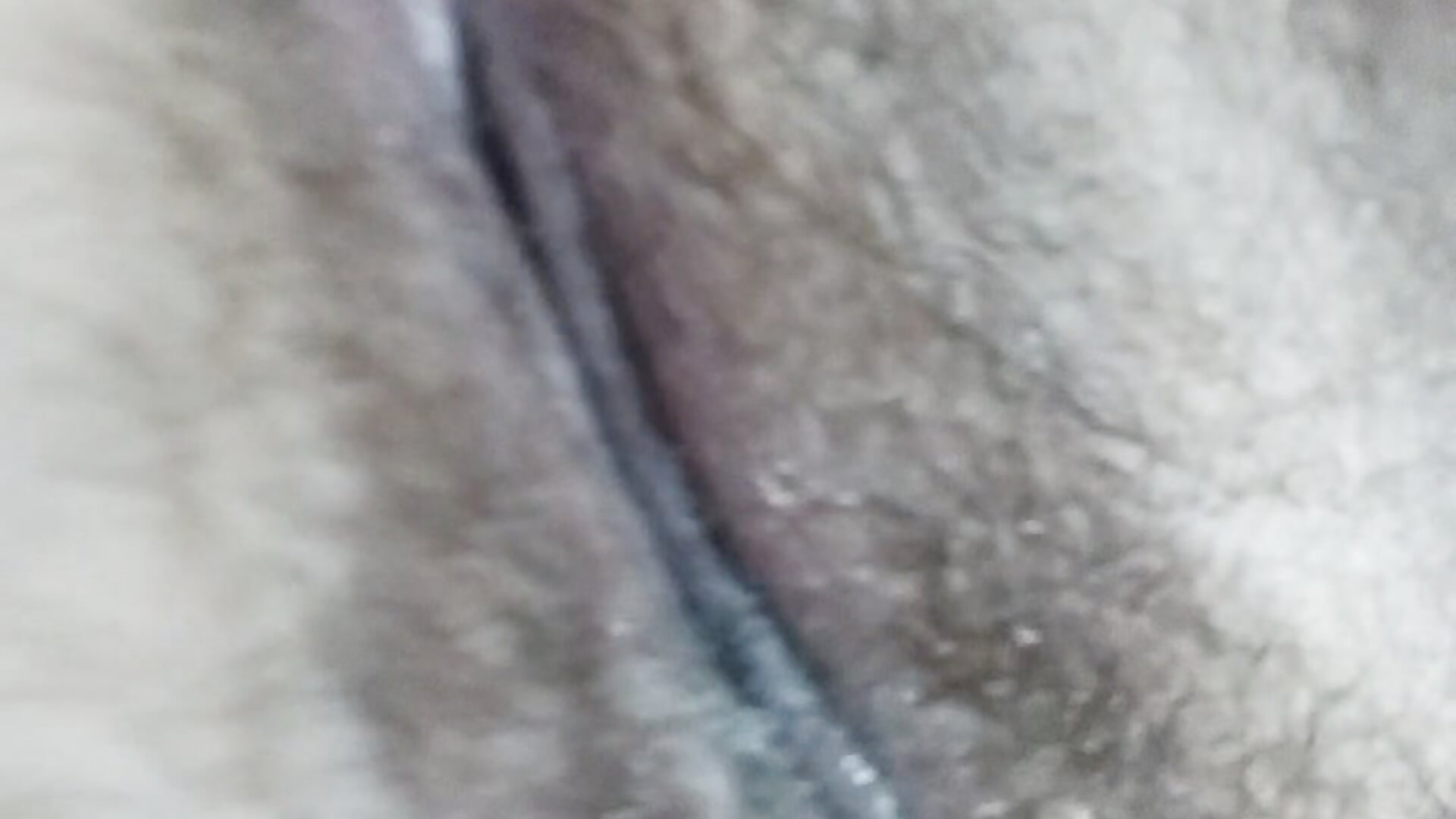 Hairy pussy with cum on clit
