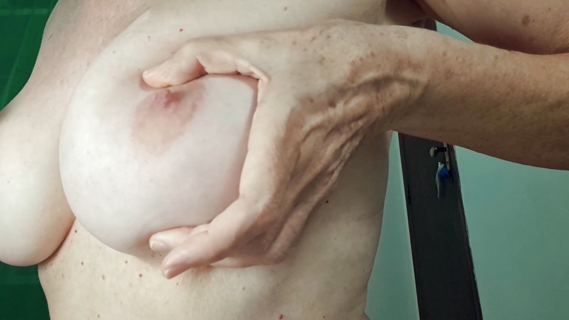 Plucking hairs from the breasts