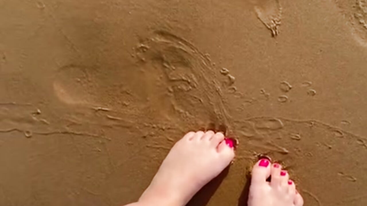 feet in the sand