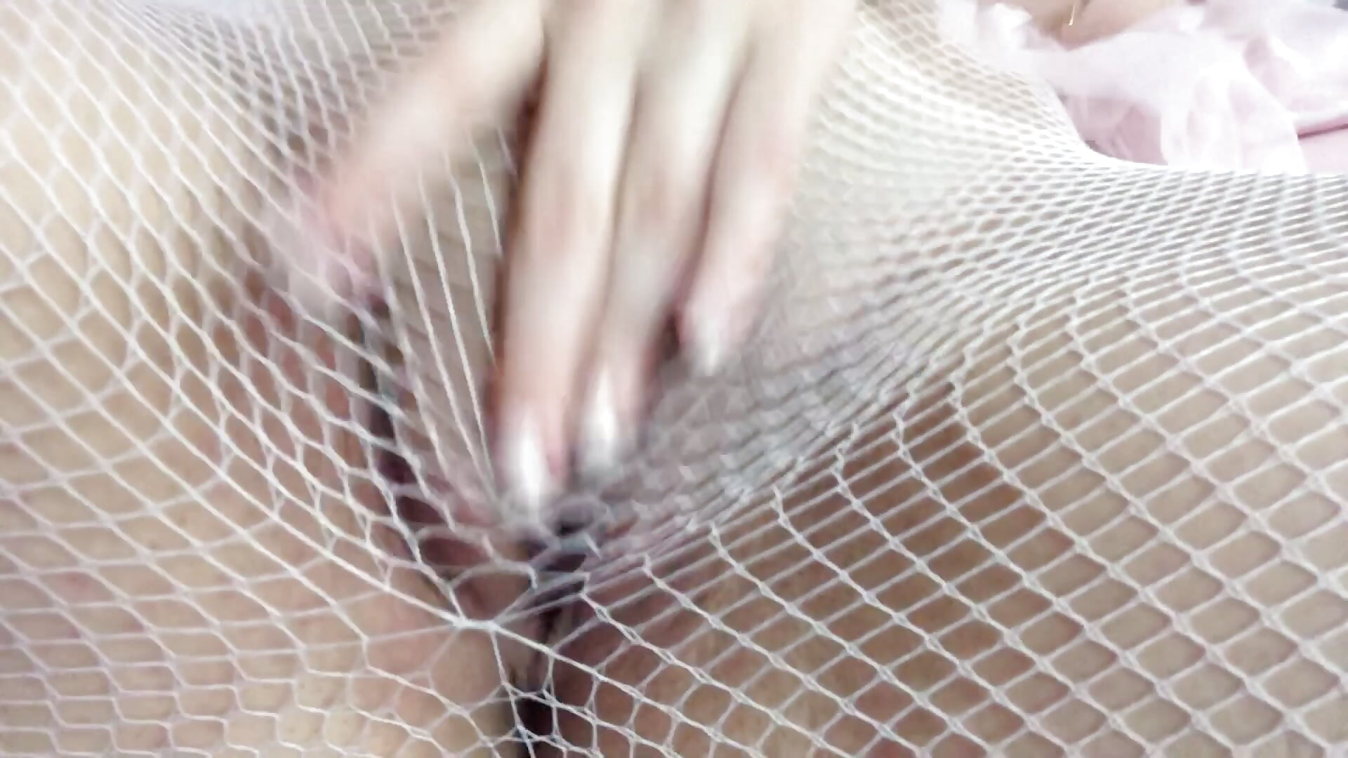 A bit of fingering through pink fishnet stockings