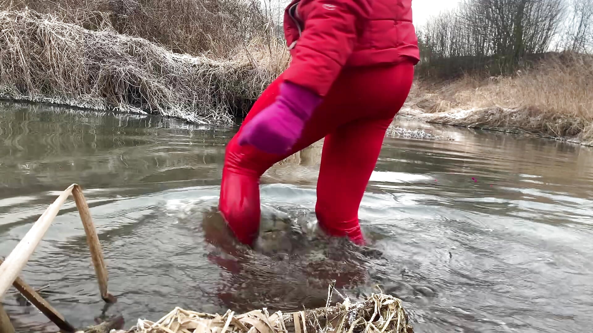 Swim in iced river at February. Wetlook red sport outfit.