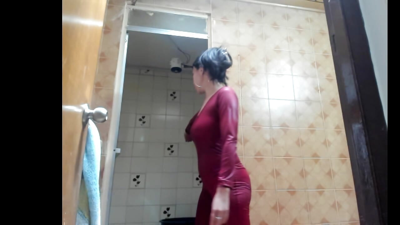 Mistrees in the shower wetting sexy catsuit