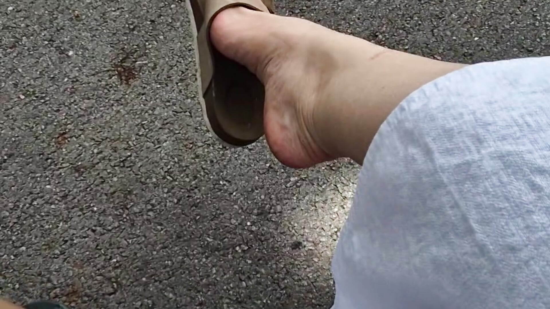 Teasing u with my feet in flip flops outside