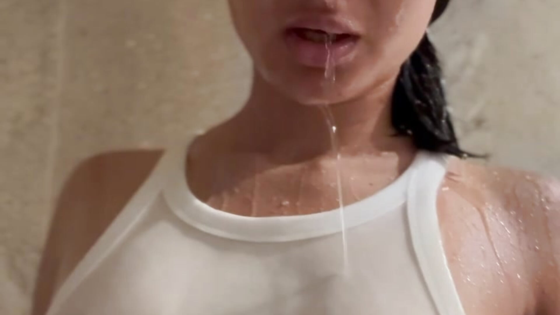 Shower video with wet top and naked boobs